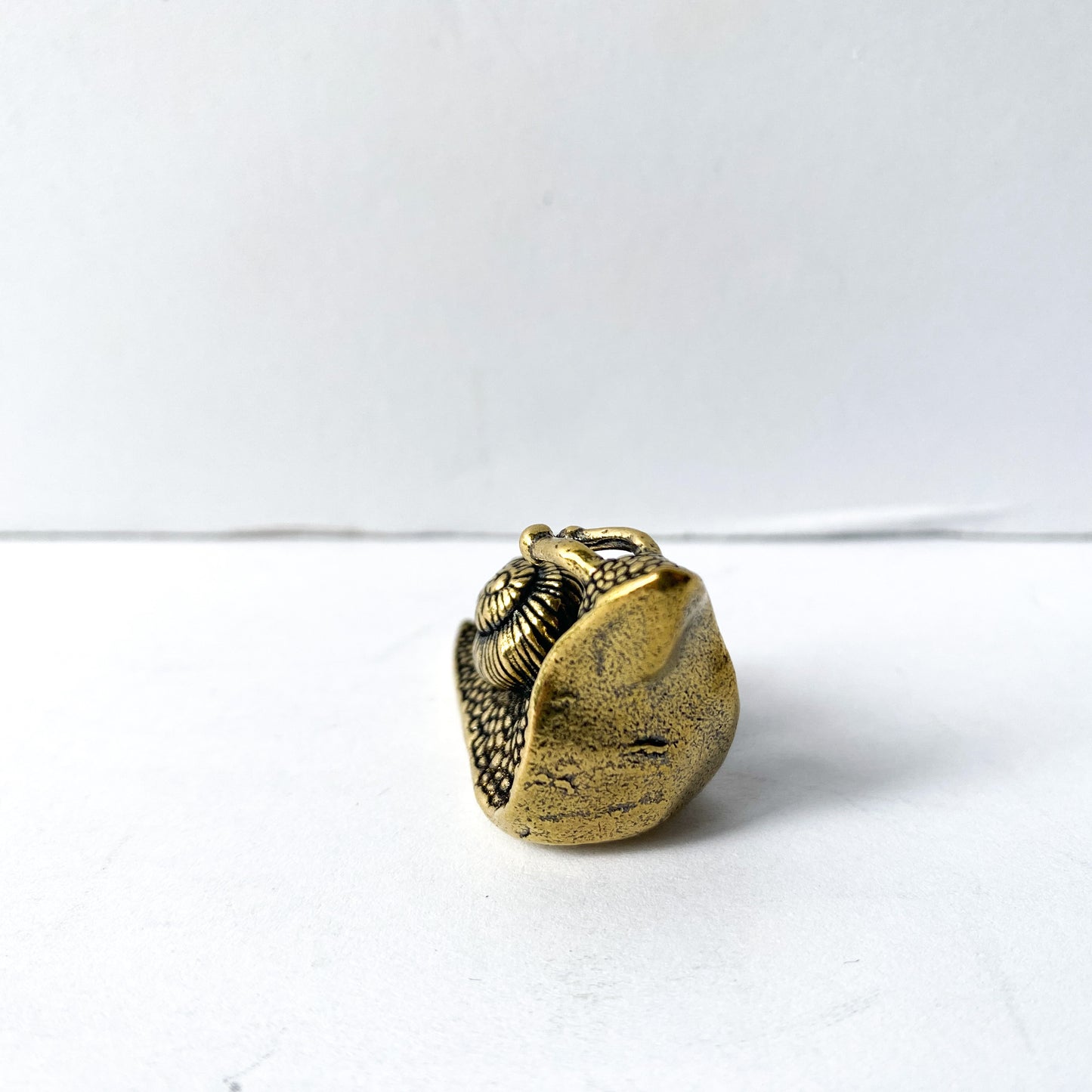 Miniature brass snail figurine