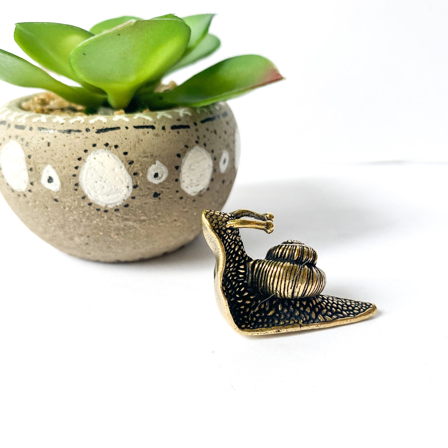 Miniature brass snail figurine