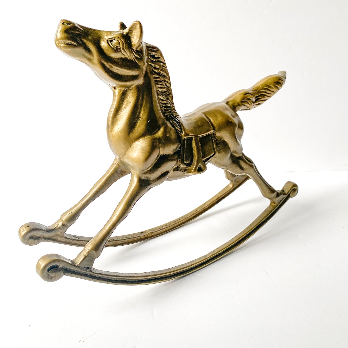 Vintage brass rocking horse sculpture