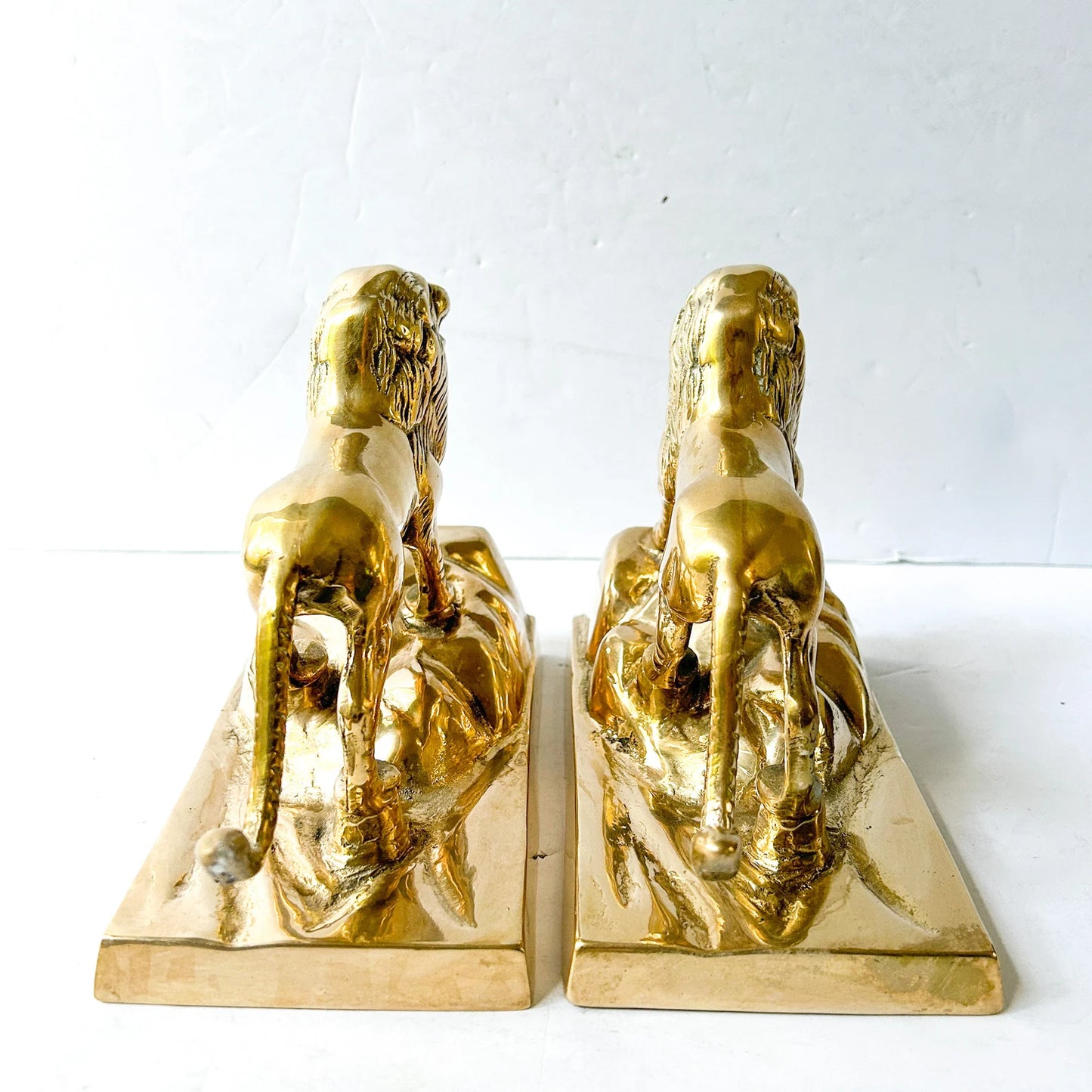 Vintage brass lion bookends