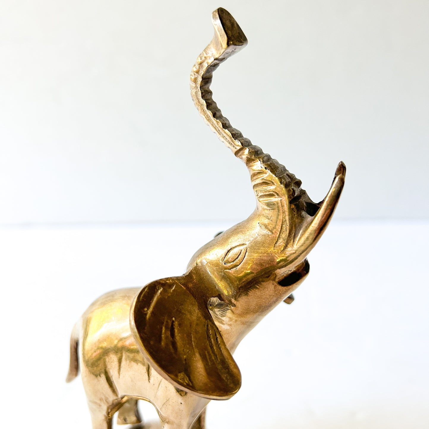 Vintage brass elephant on ball