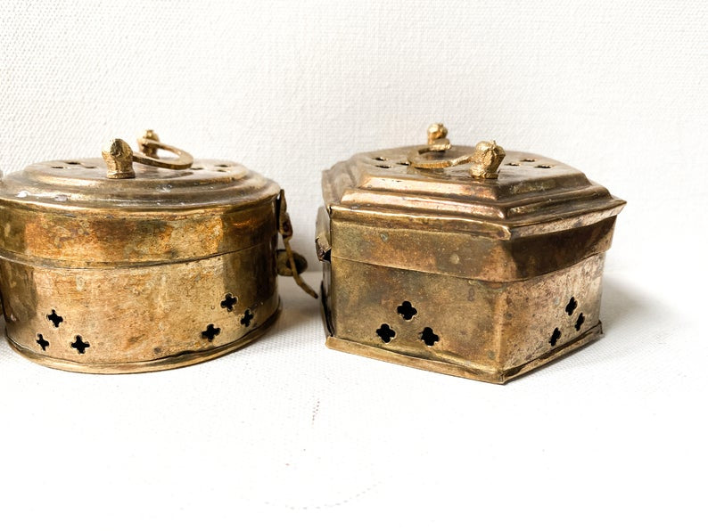 Set of four small brass cricket boxes,  incense holders