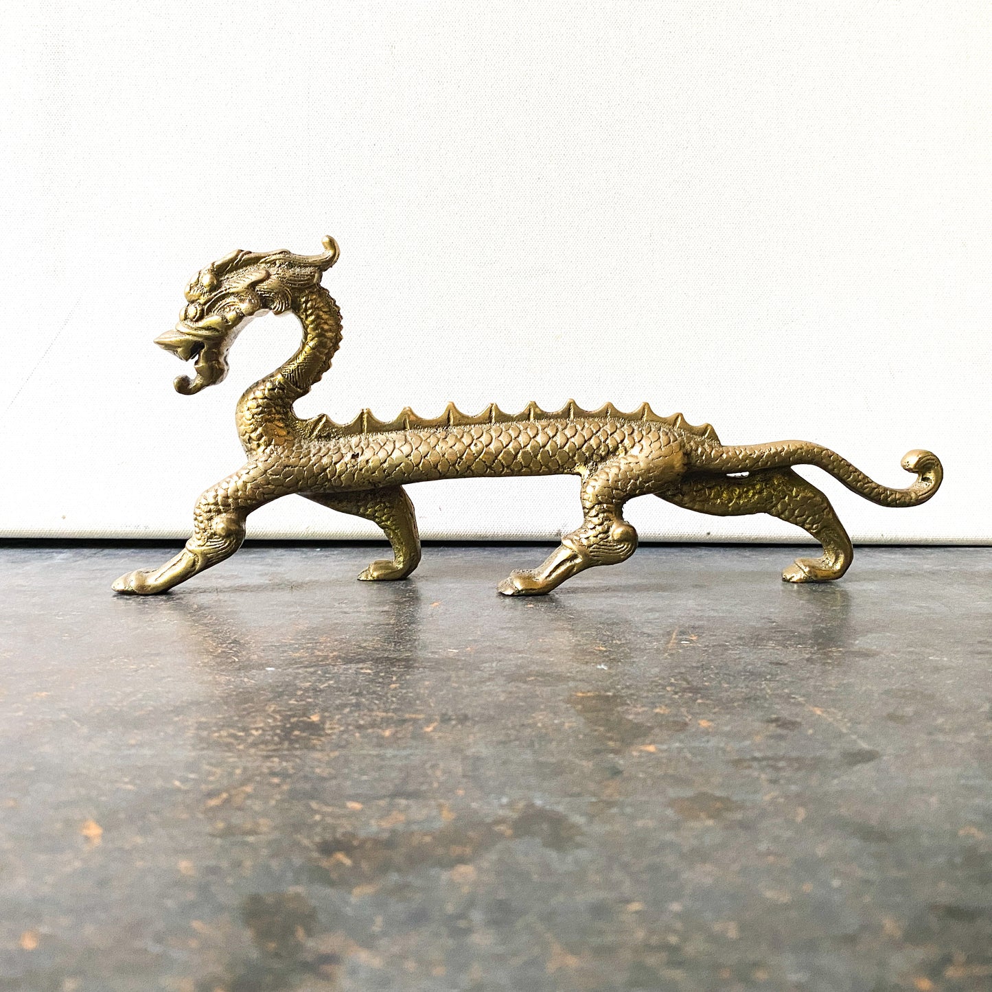 Long, vintage brass dragon
