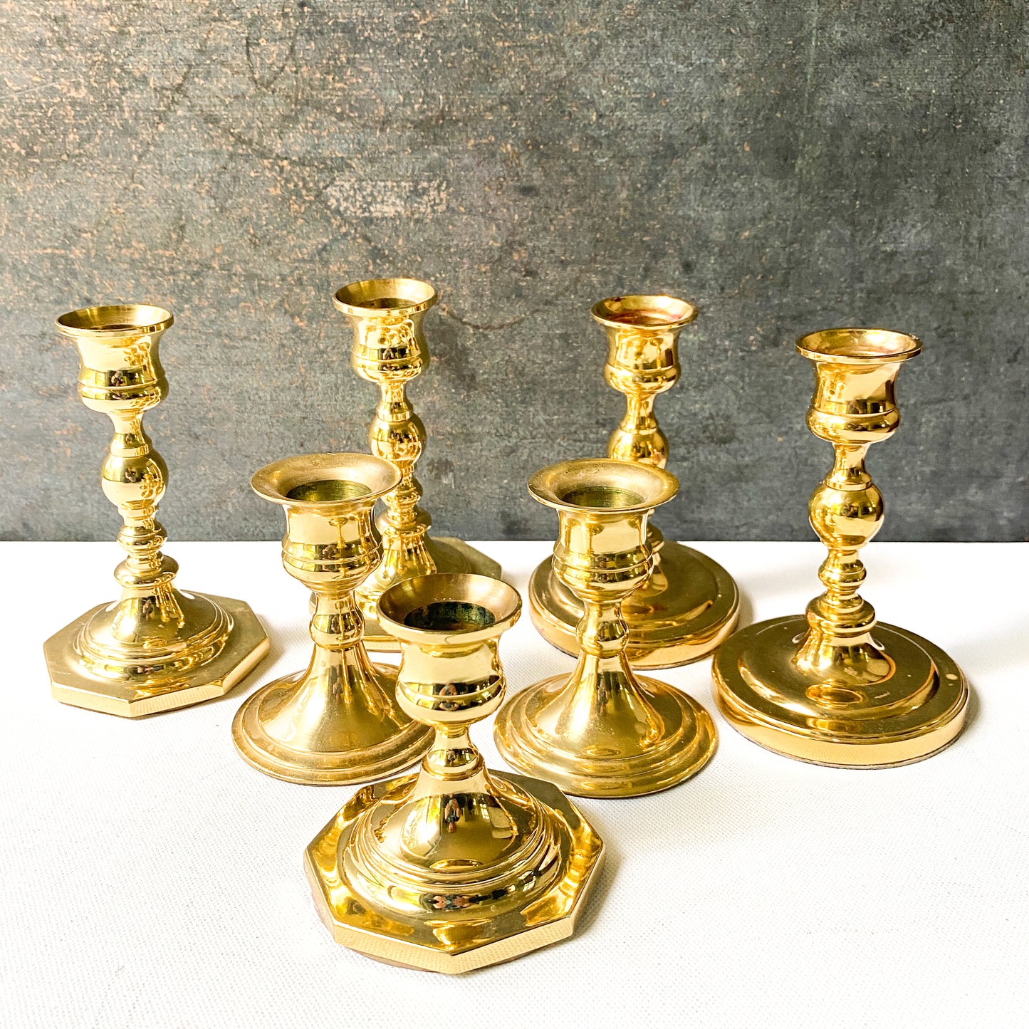 Assorted vintage brass candle holder collection, set of 7