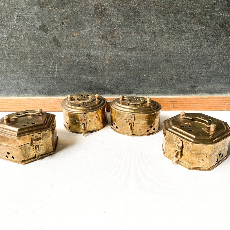 Set of four small brass cricket boxes,  incense holders