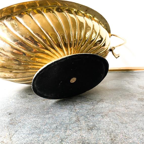 Vintage brass pedestal bowl with serpent handles